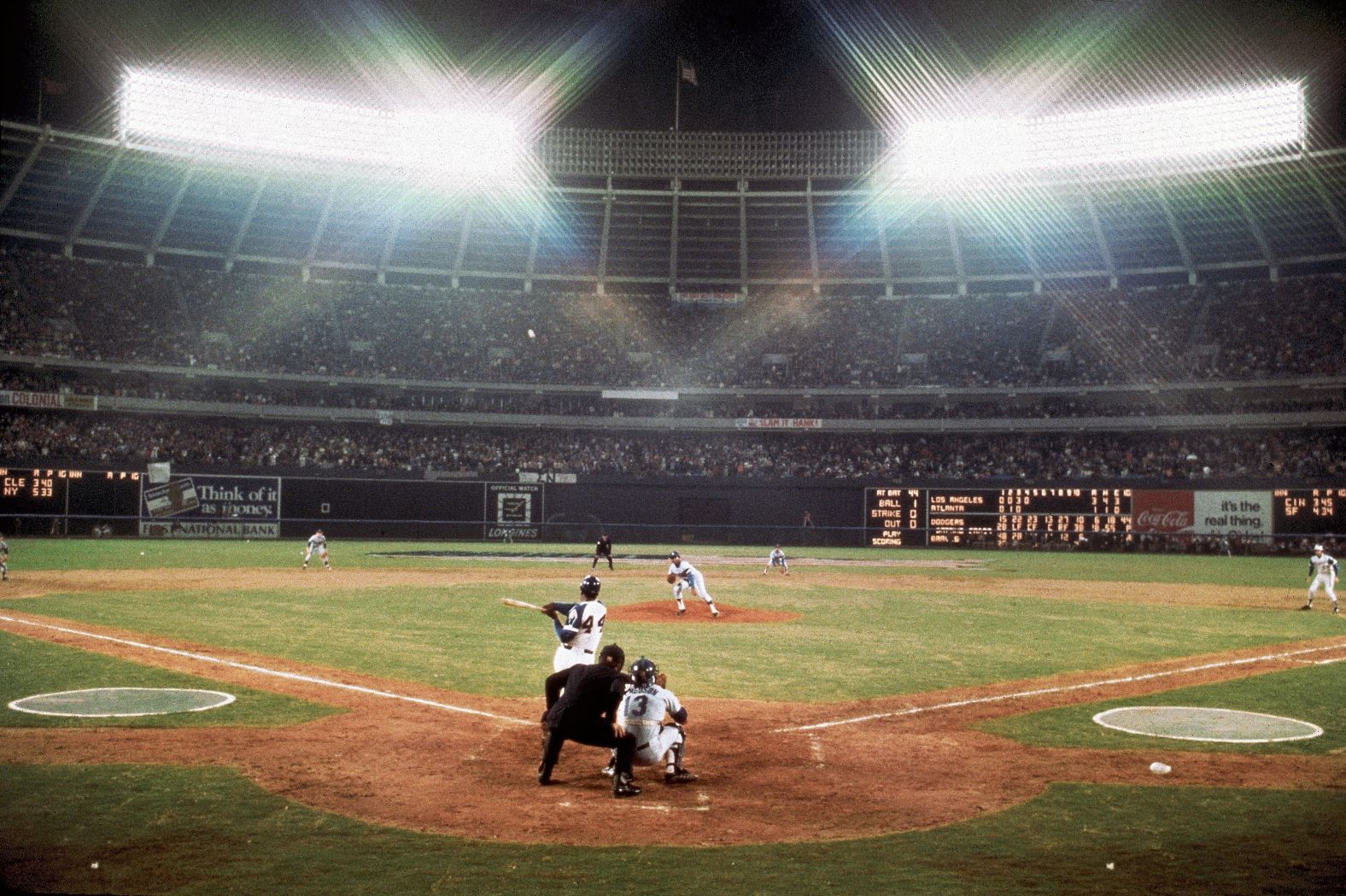 Aaron hits his record-breaking 715th home run at Atlanta-Fulton County Stadium on April 8, 1974.