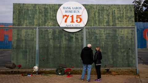 People pay respects at the Hank Aaron Home Run wall in Atlanta, Georgia, on January 22, 2021.