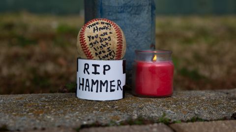 Danny Welch left behind a ball to pay his respects at the Hank Aaron Home Run wall in Atlanta, Georgia, on January 22, 2021.