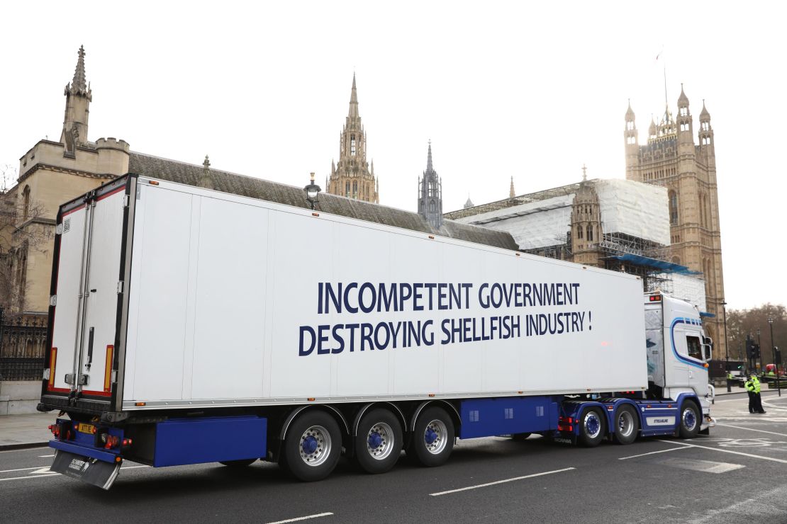 A truck drives past the Houses of Parliament in a protest against post-Brexit red tape.