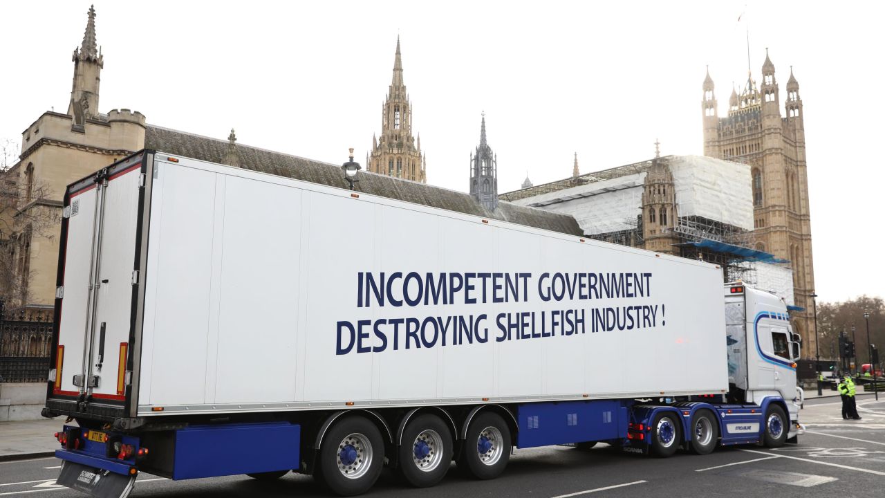 A truck drives past the Houses of Parliament in a protest against post-Brexit red tape.