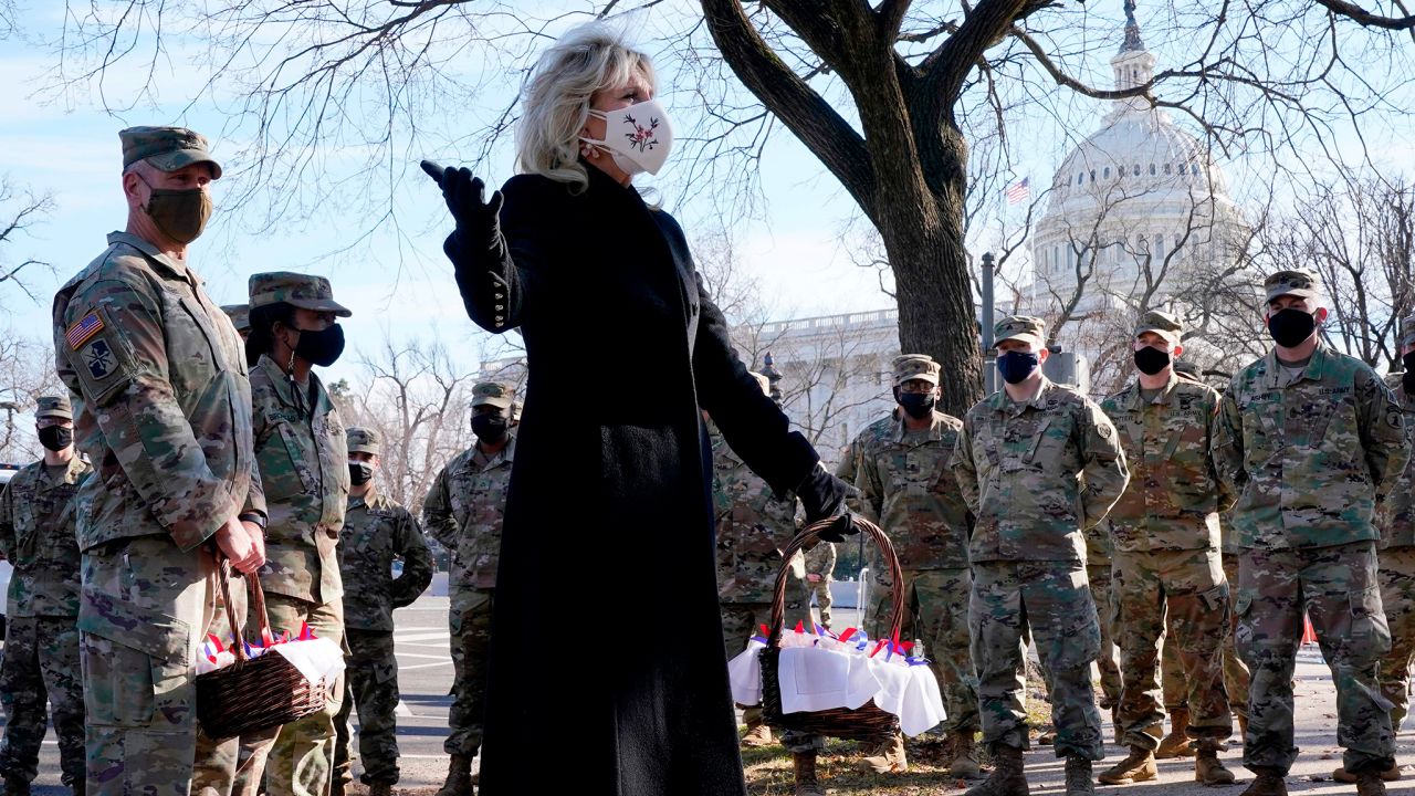 US First Lady Jill Biden surprises National Guard members outside the Capitol with chocolate chip cookies on January 22, 2021, in Washington, DC.  (Photo by Jacquelyn Martin / POOL / AFP) (Photo by JACQUELYN MARTIN/POOL/AFP via Getty Images)