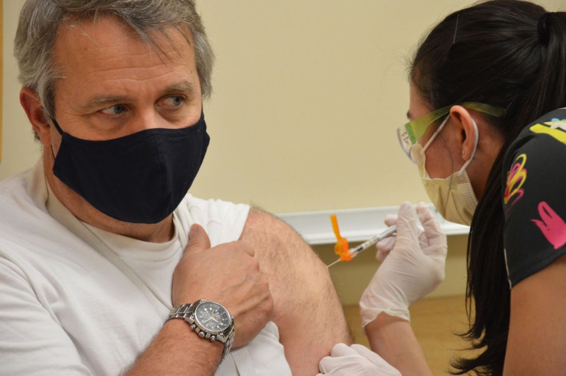 Deputy Fire Chief Rich Elliott of Kittitas Valley Fire and Rescue receives the Covid-19 vaccine in Kittitas County, Washington.