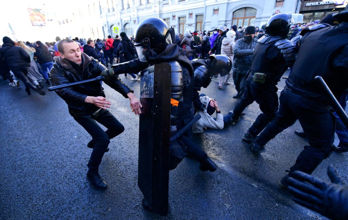 Demonstrators clash with riot police during a rally in Vladivostok on January 23, 2021.