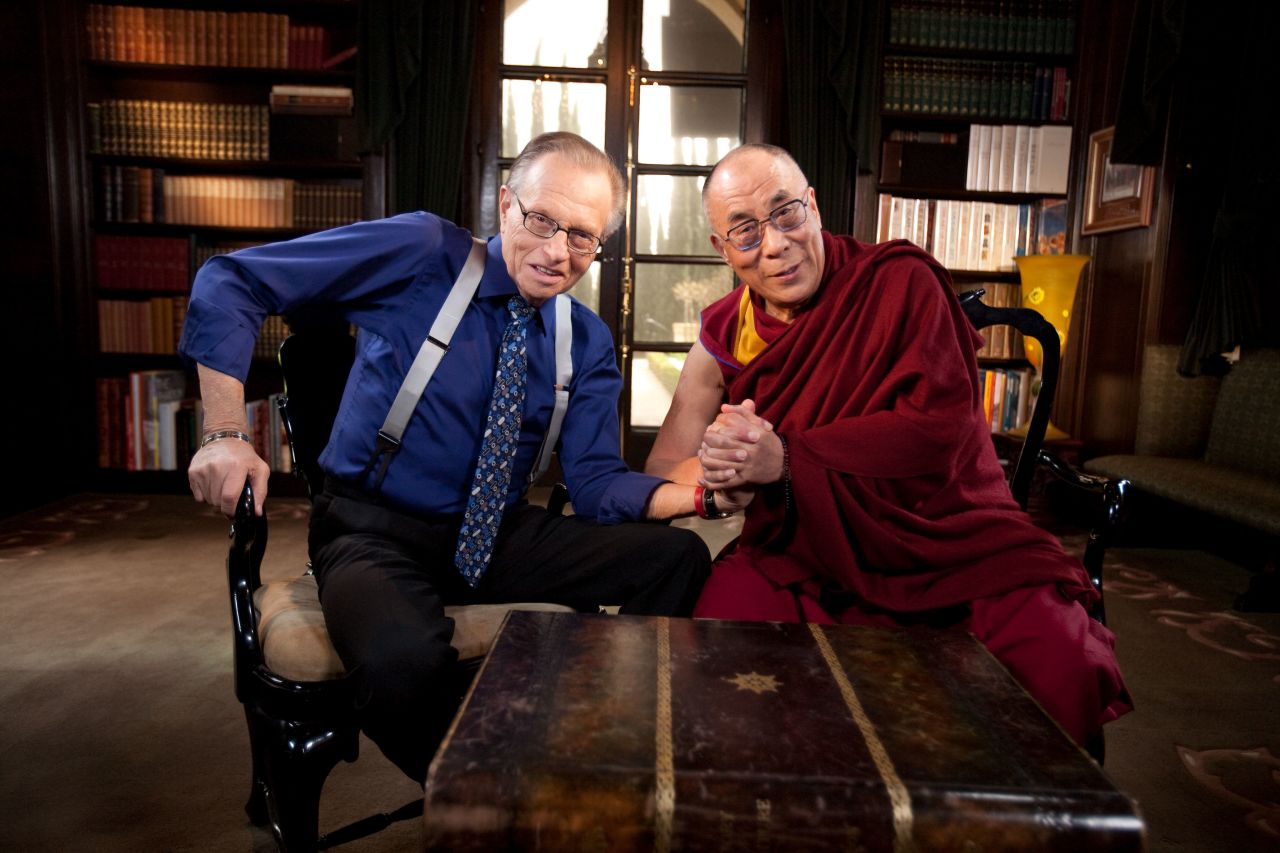 King poses for a photo with the Dalai Lama during an interview for "Larry King Live" in 2010.
