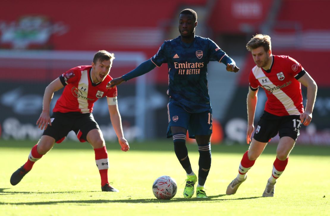 Arsenal's Nicolas Pepe is challenged by James Ward-Prowse (left) and Stuart Armstrong.