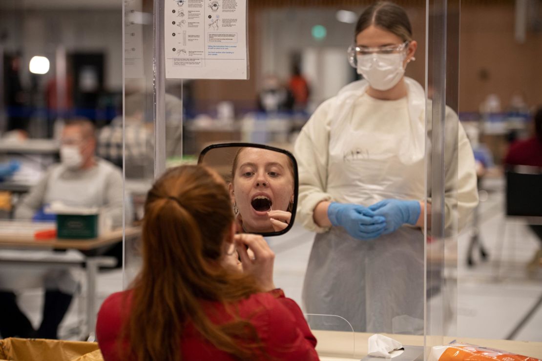 A student takes a swab for a Covid-19 test at the University of Hull in northern England on November 30, 2020.