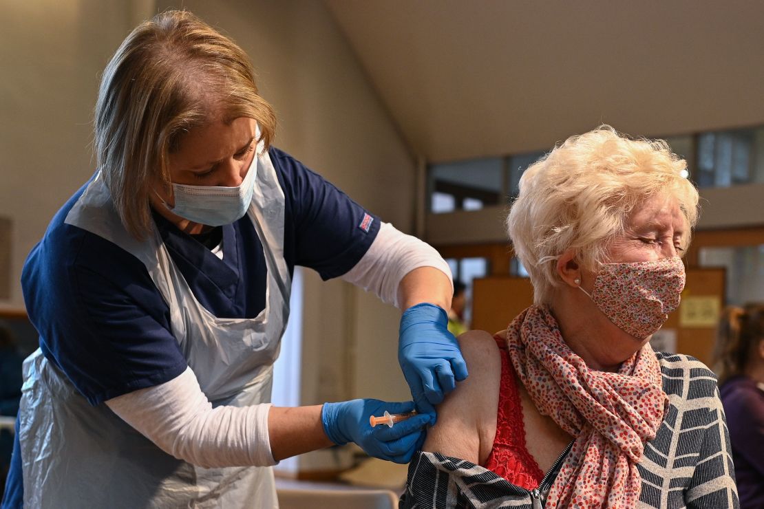 A woman from the top four priority groups receives the Oxford/AstraZeneca vaccine at a church in Yorkshire, northern England on January 23.