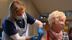 A member of the public receives the Oxford/AstraZeneca Covid-19 vaccine at a temporary vaccination centre in St Columba's Church in Sheffield, south Yorkshire on January 23, 2021. - Britain's Prime Minister Boris Johnson has revealed that 5.4 million people had now received their first dose of two vaccines currently being administered, with a daily record of 400,000 people inoculated in the last 24 hours. (Photo by Oli SCARFF / AFP) (Photo by OLI SCARFF/AFP via Getty Images)