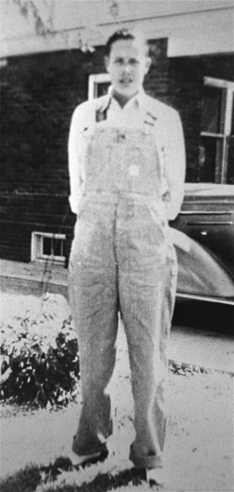 Dole stands in front of a 1936 Chevrolet in his hometown of Russell, Kansas. Dole studied at the University of Kansas and played for the school's basketball, football and track teams before World War II broke out.