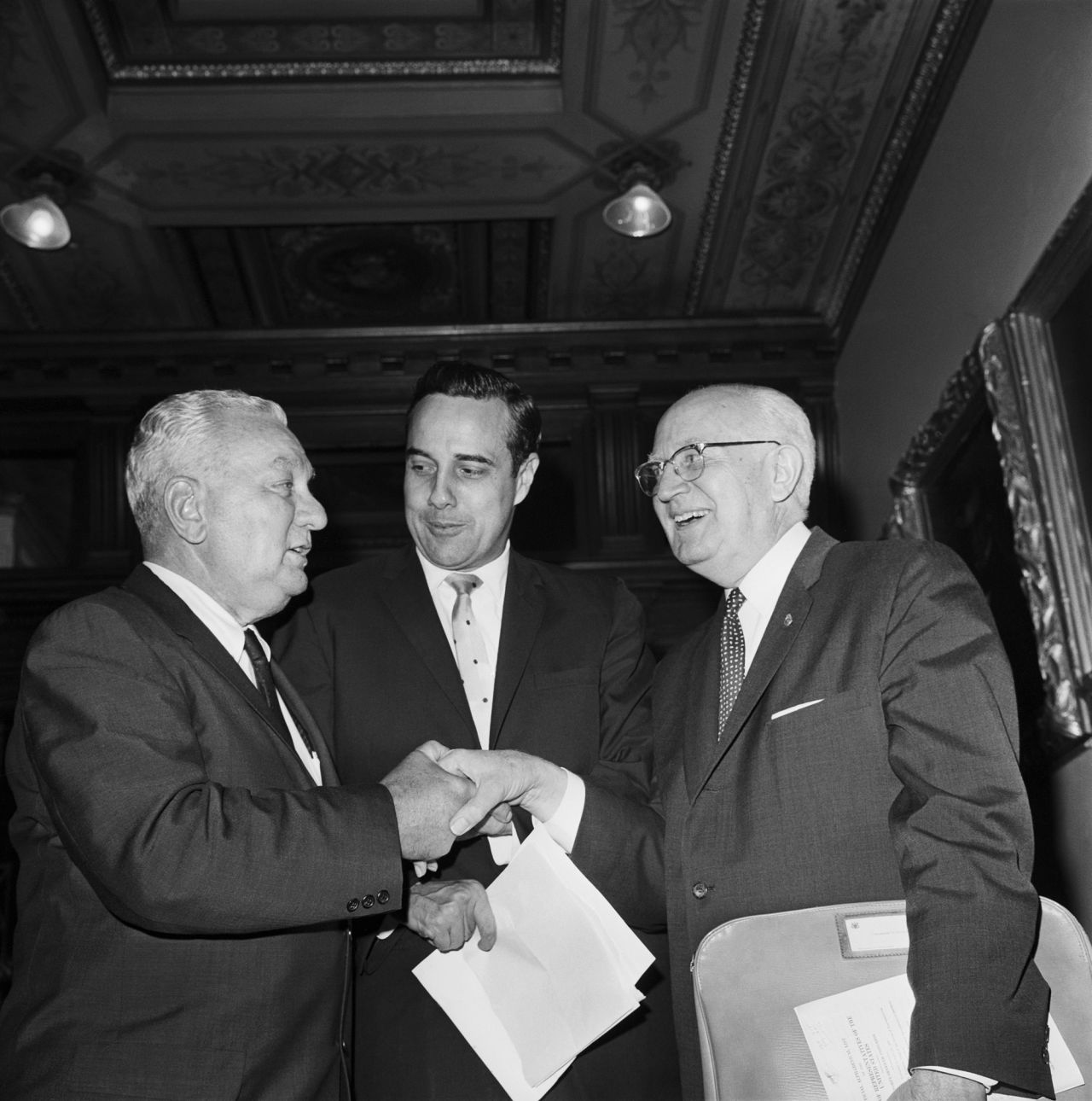 Dole is seen between fellow US Reps. Charles A. Halleck and Charles B. Hoeven in 1962. After the war, Dole went into politics. He served in the Kansas House of Representatives before becoming Russell County prosecutor in 1953. In 1960, Dole was elected to the US House of Representatives.