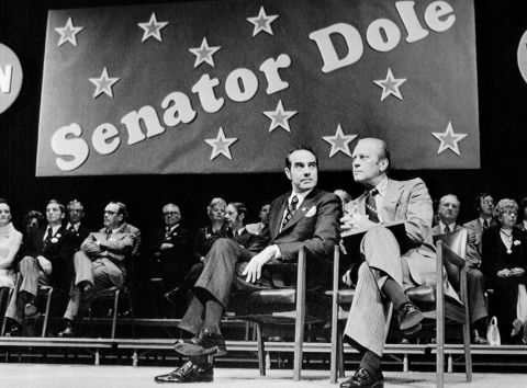 Dole became a US senator in 1969 and held the office until 1996. Here, Dole is joined by President Gerald Ford, who was in Wichita, Kansas, to give Dole a re-election boost in 1974. Dole would later become Ford's running mate in the 1976 presidential election.