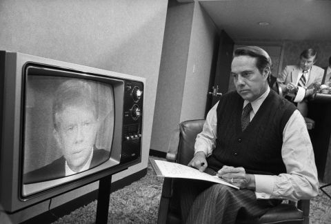 Dole takes notes as he watches President Jimmy Carter speak in 1980. Dole was making his first run for president.