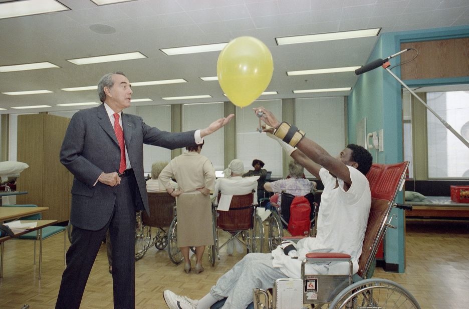 Dole tosses a balloon for Clarence Fondren to hit back during a campaign stop at the Chicago Rehabilitation Institute in 1988.