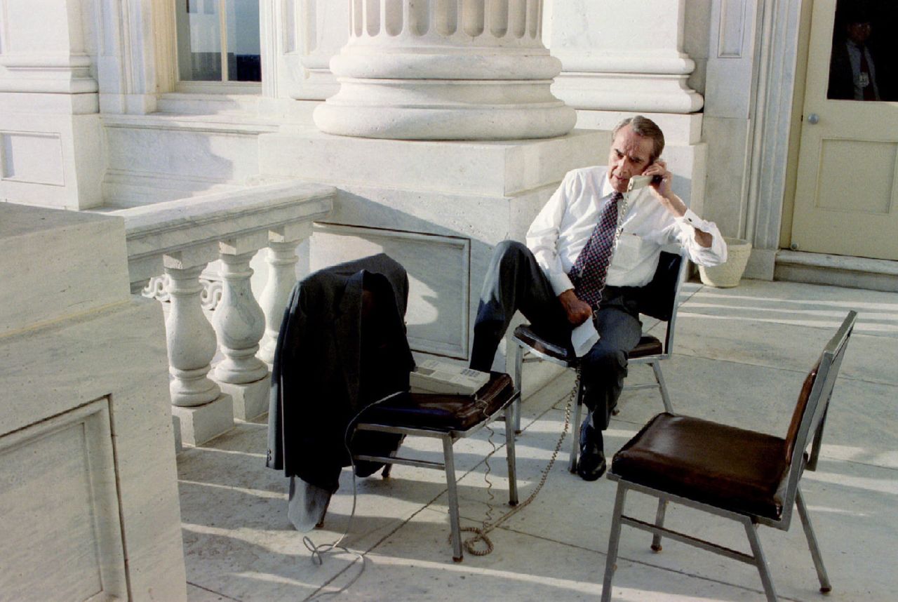 Dole works the phones from his office balcony at the US Capitol in 1996.