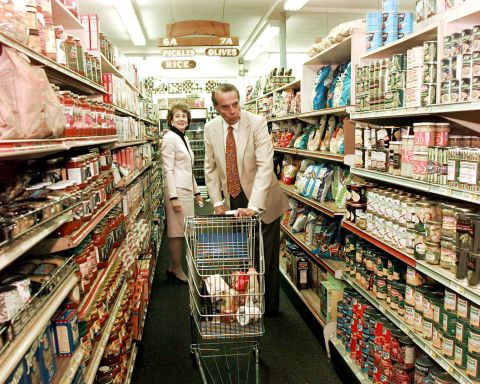 Dole and his wife, Elizabeth, shop at a Florida food market in 1996.