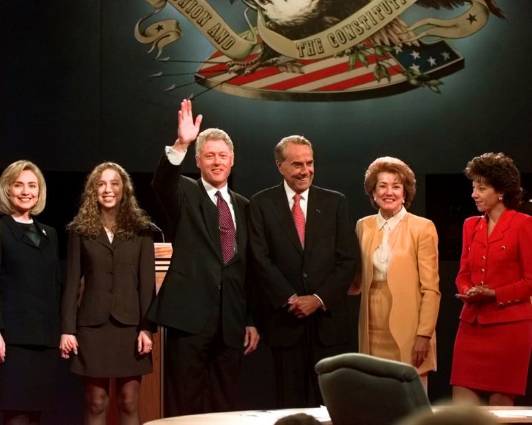 Dole, his wife and his daughter pose with President Bill Clinton and his family after their first presidential debate in 1996.