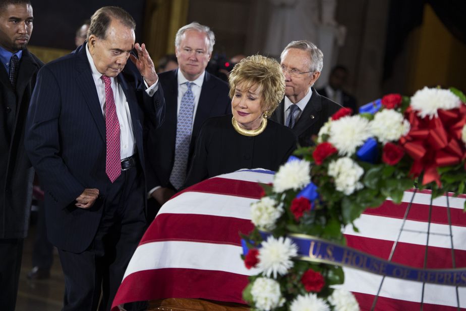 Dole salutes the casket of US Sen. Daniel Inouye as his body lies in state in the US Capitol rotunda in 2012. Dole and Inouye knew each other since they were recovering from their World War II battle wounds.