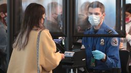 CHICAGO, ILLINOIS - OCTOBER 19: A Transportation Security Administration (TSA) agent screens an airline passenger at O'Hare International Airport on October 19, 2020 in Chicago, Illinois. Yesterday the TSA reported that it had screened over 1 million passengers, representing the highest number of passengers screened at TSA checkpoints since March 17, 2020. During the week ending October 18, TSA screened 6.1 million passengers nationwide, the highest total since the start of the COVID-19 pandemic.  (Photo by Scott Olson/Getty Images)