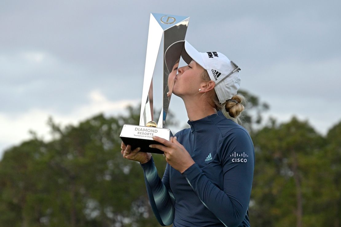 Jessica Korda kisses the championship trophy after winning the playoff against Danielle Kang.