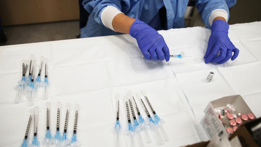 A pharmacy technician prepares a dose of the COVID-19 Pfizer vaccine to be administered to a patient at Harbor-UCLA Medical Center amid a surge of coronavirus patients on January 21, 2021 in Torrance, California. California has become the first state in the nation to record 3 million known COVID-19 infections. Los Angeles County reported more than 250 COVID-19 fatalities on January 21. (Photo by Mario Tama/Getty Images)