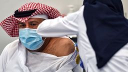 This picture taken on December 17, 2020 shows the first Saudi citizen receiving the Pfizer-BioNTech COVID-19 coronavirus vaccine (Tozinameran) in the capital Riyadh, as part of a vaccination campaign by the Saudi health ministry. (Photo by FAYEZ NURELDINE / AFP) (Photo by FAYEZ NURELDINE/AFP via Getty Images)