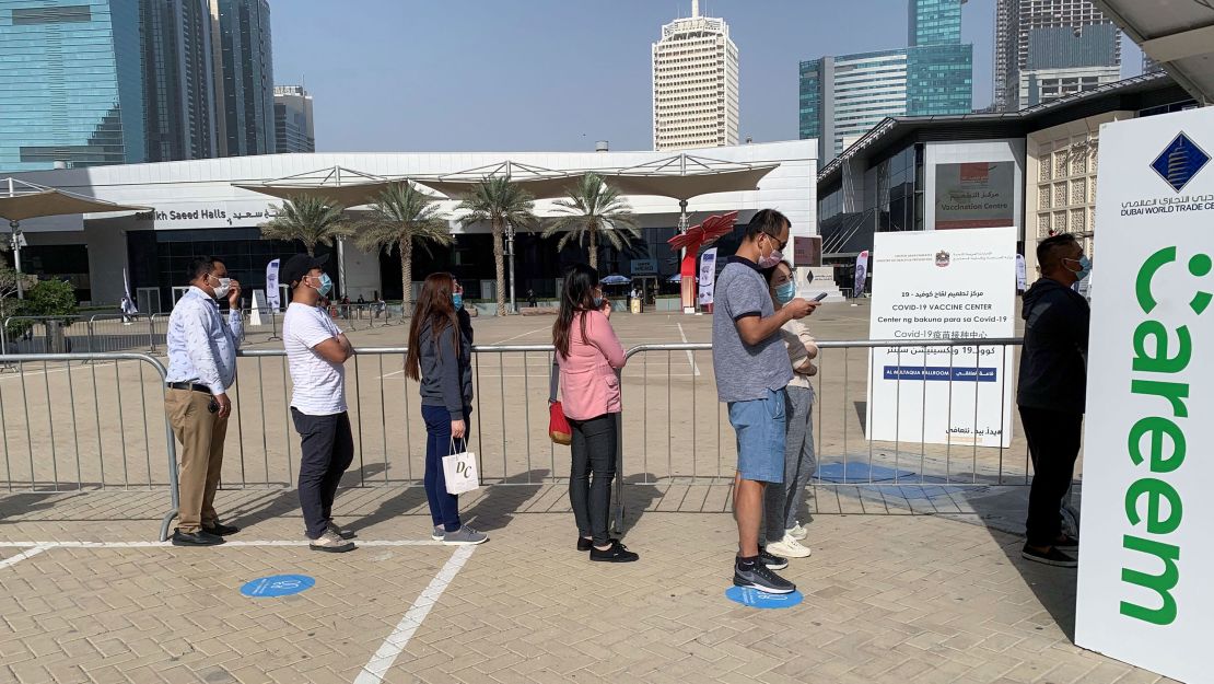 People line up at a vaccination facility in Dubai's financial center district on January 24, 2021.