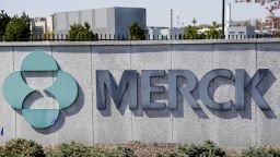 FILE- This May 1, 2018, file photo shows Merck corporate headquarters in Kenilworth, N.J.  Surging sales of cancer medicines and reduced spending helped Merck overcome a big hit from the coronavirus pandemic and increase its profit 12% in the second quarter. The  drugmaker on Friday, July 31, 2020,  increased its financial forecast for the year, all while it's investing in development of two experimental vaccines and a possible treatment for COVID-19.  (AP Photo/Seth Wenig, File)