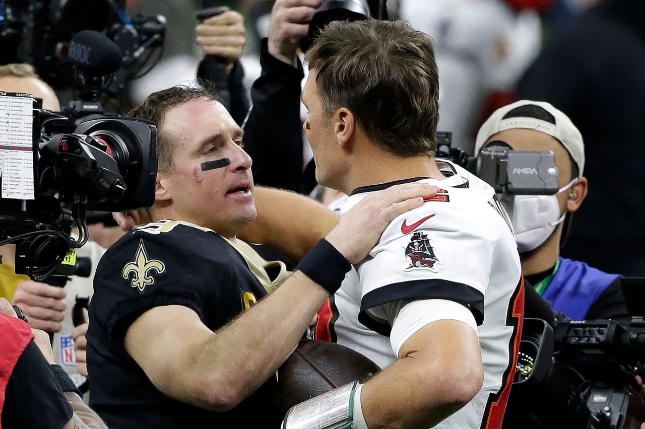 New Orleans quarterback Drew Brees congratulates Brady after the Buccaneers defeated Brees' Saints in an NFL playoff game in January 2021. It was the first playoff game in NFL history to feature two starting quarterbacks in their 40s. Both players occupy the top two spots for many of the league's quarterback records.