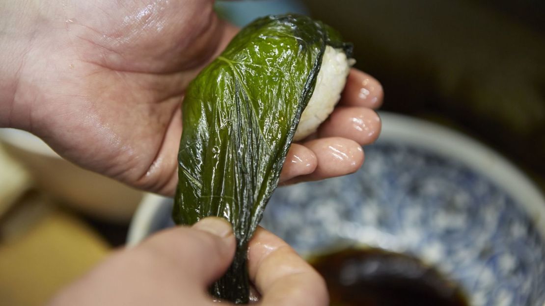 Mehari-zushi features rice balls wrapped in pickled mustard greens -- a Wakayama specialty. 