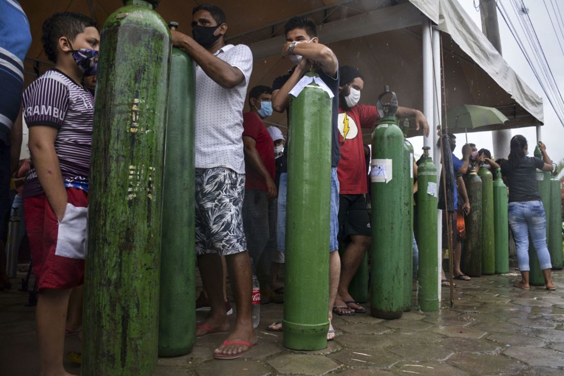 Relatives of patients infected with Covid-19 queue for long hours to refill their oxygen tanks at the Carboxi company in Manaus, Amazonas state, Brazil, on January 19, 2021. 