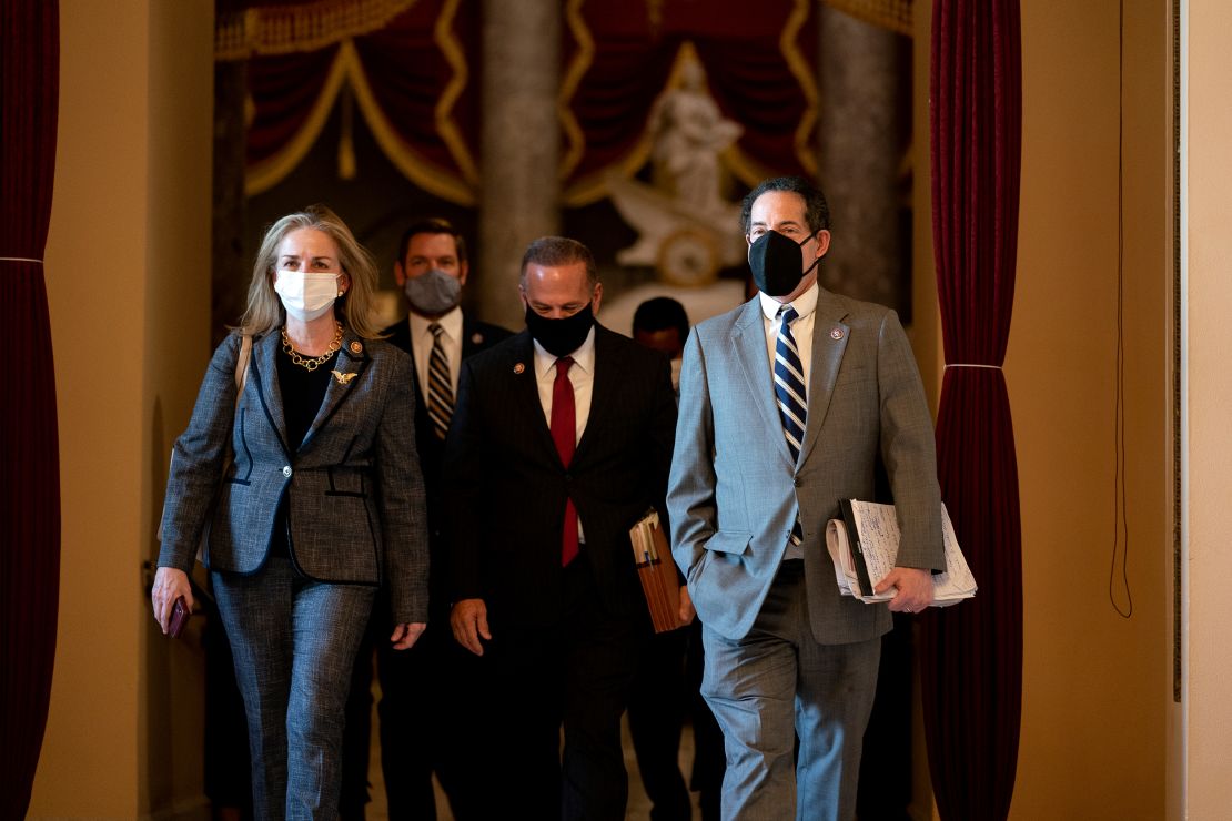 From left, House Impeachment Managers Rep. Madeleine Dean of Pennsylvania, Rep. Eric Swalwell of California, Rep. David Cicilline of Rhode Island, and Raskin wear protective masks while walking to the House Floor on January 13.