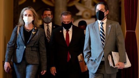 From left, House Impeachment Managers Rep. Madeleine Dean of Pennsylvania, Rep. Eric Swalwell of California, Rep. David Cicilline of Rhode Island, and Raskin wear protective masks while walking to the House Floor on January 13.