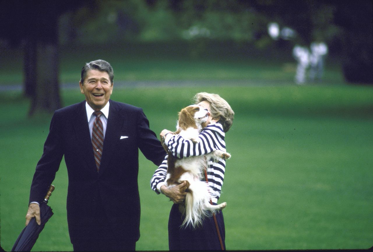 Ronald Reagan and first lady Nancy Reagan are joined by their dog Rex after visiting Camp David. Rex was a Cavalier King Charles Spaniel.