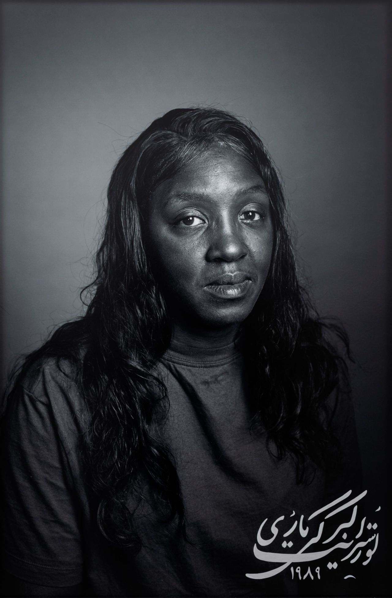 "Marie Overstreet" from "Land of Dreams" (2019). "I believe the work is unique in the way that it shows a nomadic person whose gaze is always navigating between cultures that she doesn't completely belong to anymore," Neshat writes.