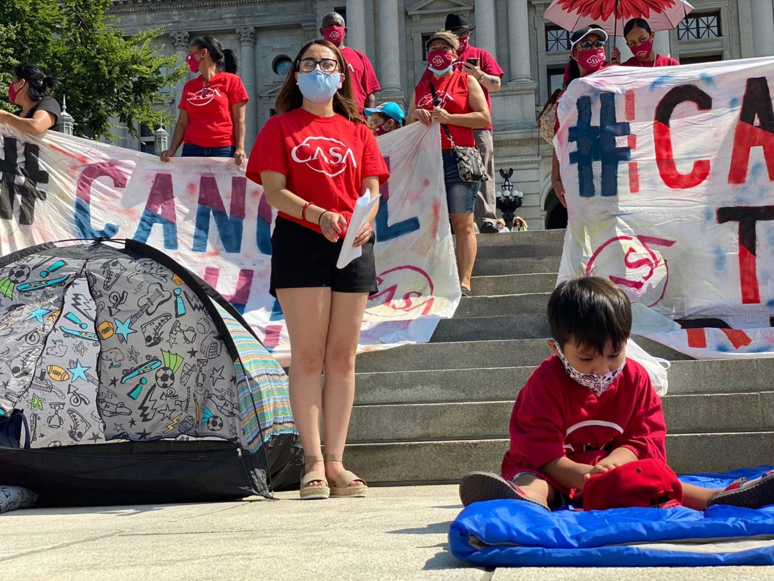 Marilú Saldaña, shown here at a protest for rent relief during the pandemic, is hoping Biden's immigration bill will help her family.