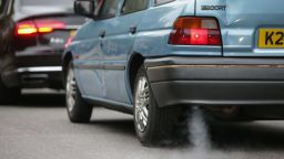 A car emits fumes from its exhaust as it waits in traffic in central London, England on October 23, 2017.