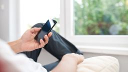 Person looking at smartphone - stock