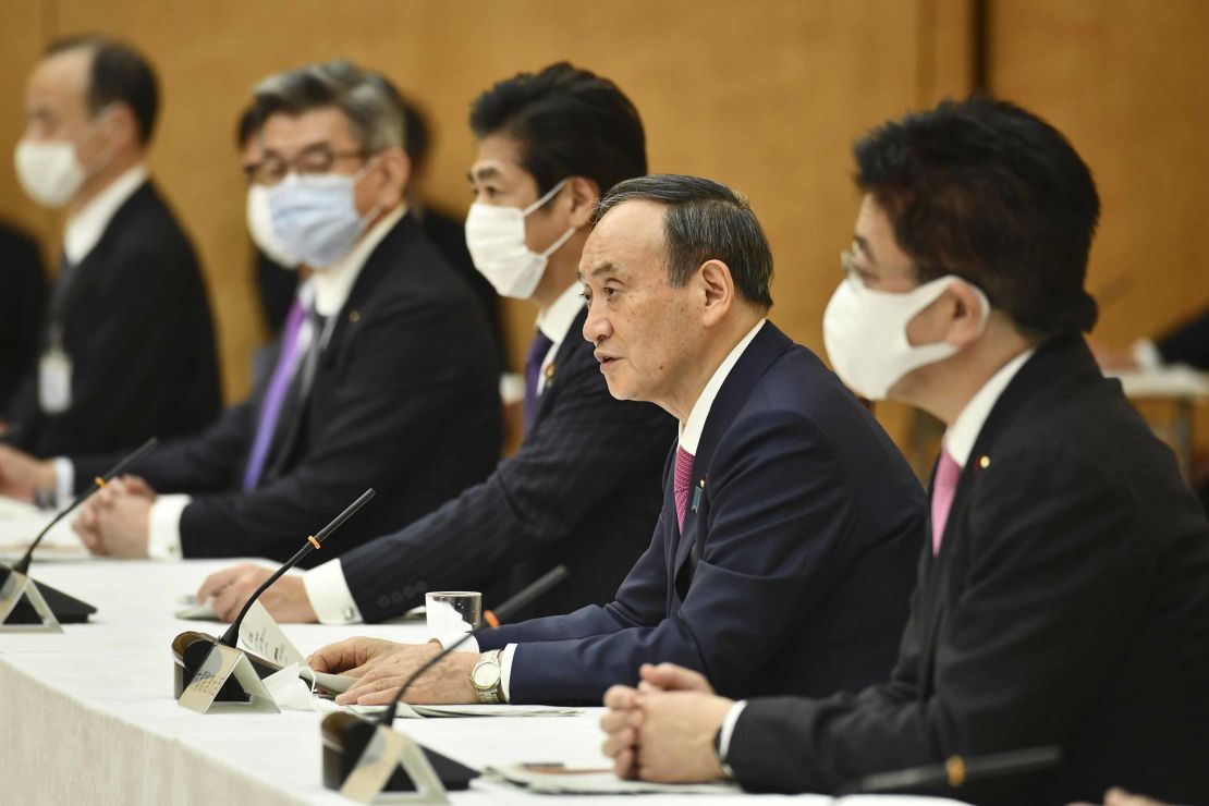 Japanese Prime Minister Yoshihide Suga, second from right, speaks during a meeting of the coronavirus infection control headquarters at his office in Tokyo on Friday, January 22.