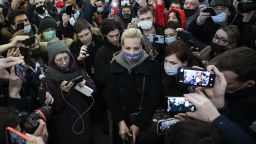 TOPSHOT - Opposition leader Alexei Navalny's wife Yulia Navalnaya (C) is seen surrounded by people as she leaves Moscow's Sheremetyevo airport upon the arrival from Berlin on January 17, 2021. - Russia's prison service confirmed Sunday that it had detained Kremlin critic Alexei Navalny at a Moscow airport shortly after he landed on a flight from Berlin. The prison service, the FSIN, said in a statement that it had detained Navalny for "multiple violations" of a 2014 suspended sentence for fraud charges, adding that "he will be held in custody" until a court ruling. (Photo by Kirill KUDRYAVTSEV / AFP) (Photo by KIRILL KUDRYAVTSEV/AFP via Getty Images)