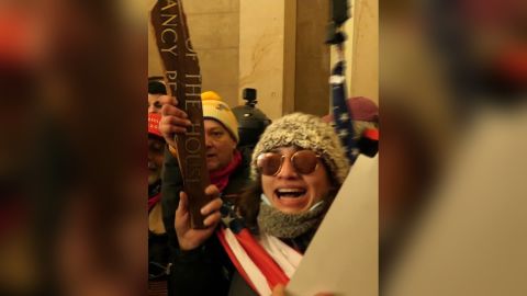 Emily Hernandez, seen here holding a piece of a sign bearing House Speaker Nancy Pelosi's name, on January 6, 2021 in the US Capitol.
