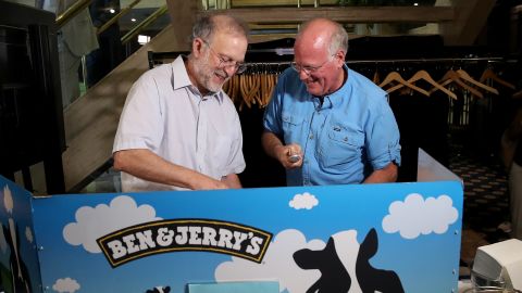 Ben & Jerry's co-founders Ben Cohen (R) and Jerry Greenfield (L) serve ice cream following a press conference announcing a new flavor on September 03, 2019 in Washington, DC.