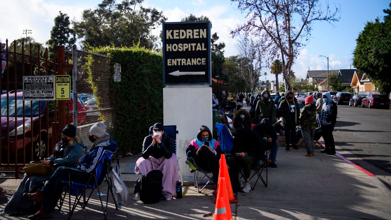 People without appointments wait in line for the potential chance to receive a Covid-19 vaccination that would have otherwise been discarded at the Kedren Community Health Center on January 25 in Los Angeles.