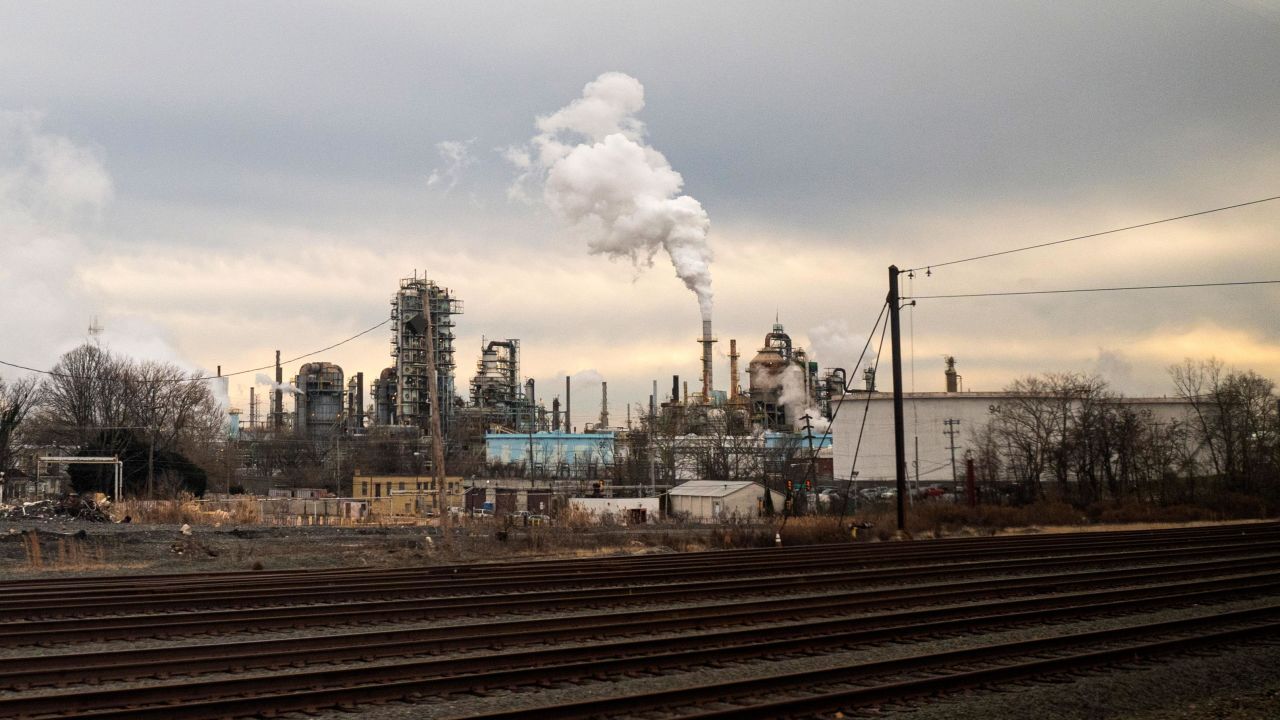 Industrial pollution pours from an oil refinery on January 8, 2021 near New Castle, Delaware.