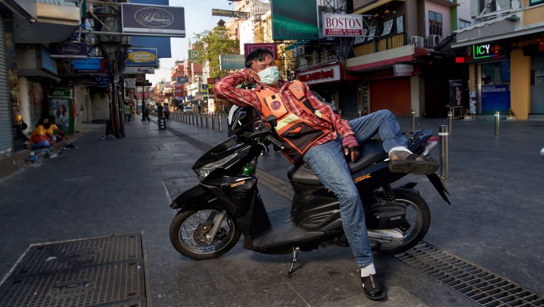 <strong>Waiting for customers: </strong>A motorcyle taxi driver rests on his bike in this photograph taken during a recent visit to Khao San Road. <strong> </strong>
