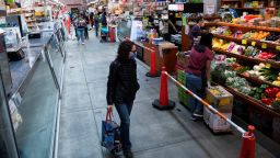 Shoppers and grocers in Eastern Market are required to wear face masks and the number of people inside at one time is limited due to the coronavirus outbreak on Saturday,  April 11, 2020. (Photo By Tom Williams/CQ-Roll Call, Inc/Getty Images)