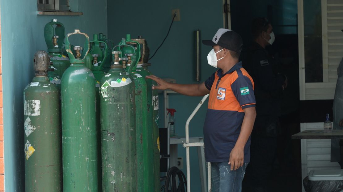 Man with oxygen tanks in Iranduba.