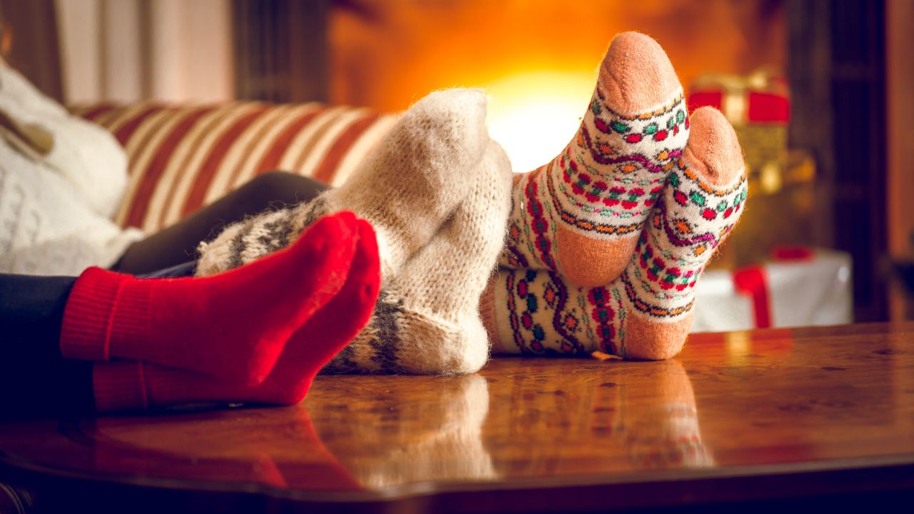 Cozying up underneath layers of clothing or blankets (or both) can help insulate you from the cold.
