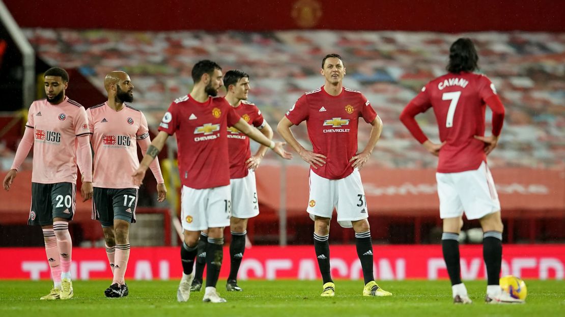 Manchester United's Nemanja Matic (centre) and team-mates appear dejected after they concede a second goal against Sheffield United. 