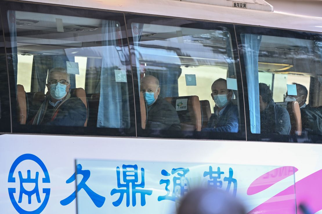 Members of the WHO team investigating the origins of the coronavirus pandemic leave The Jade Hotel on a bus after completing their quarantine in Wuhan, on January 28.